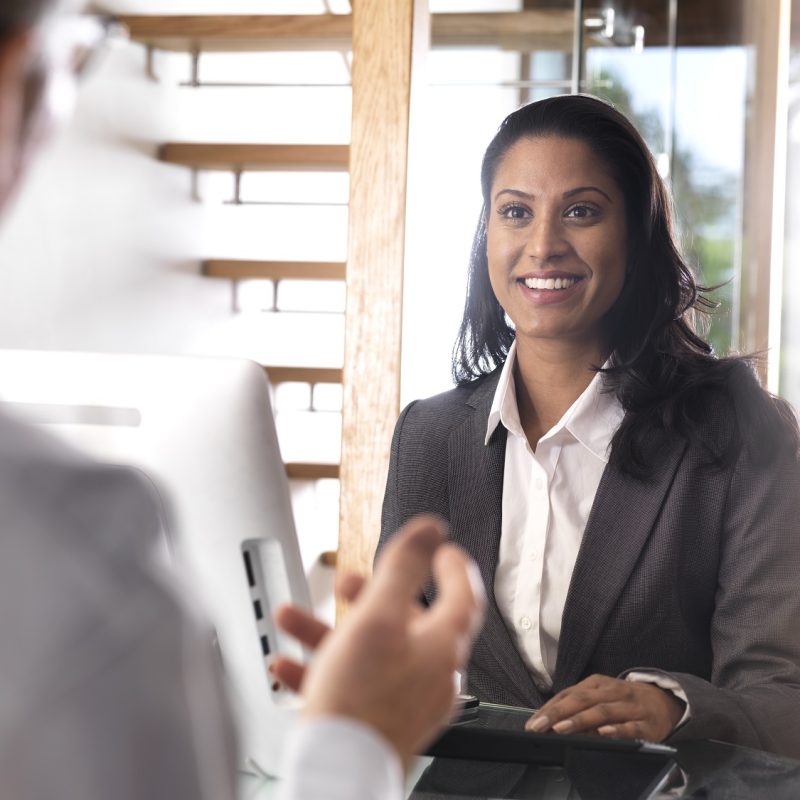 Portrait of smiling businesswoman in a meeting